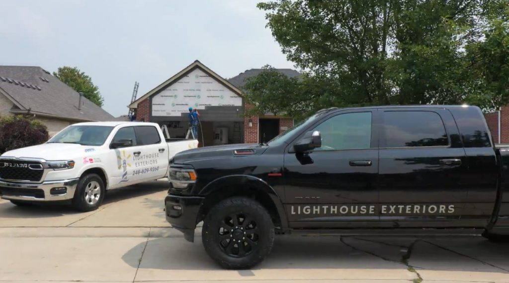 Trucks in Front of Hardie Siding Project