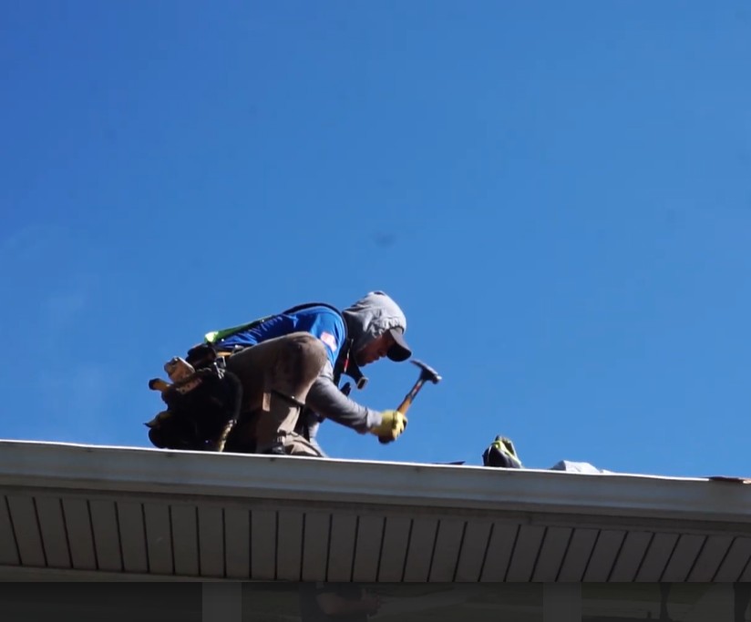 Lighthouse Exteriors Roofer on a Roof