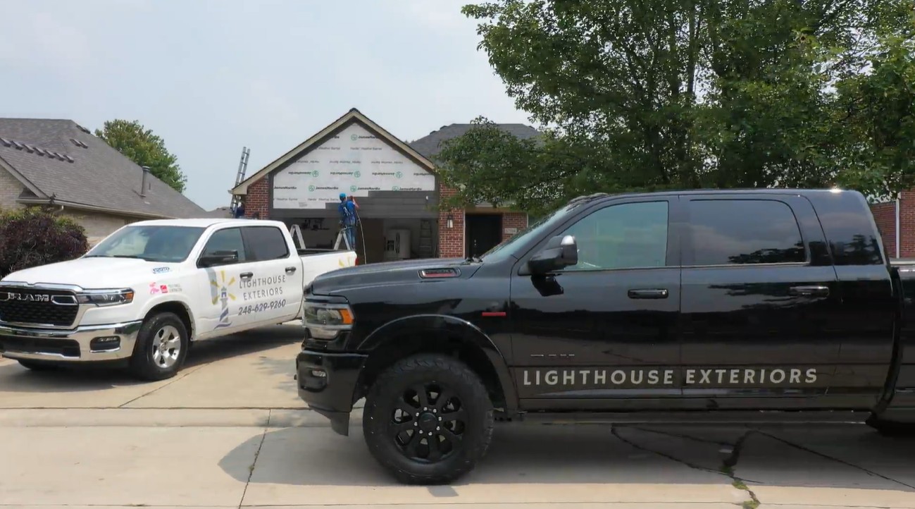 Trucks in Front of Hardie Siding Project